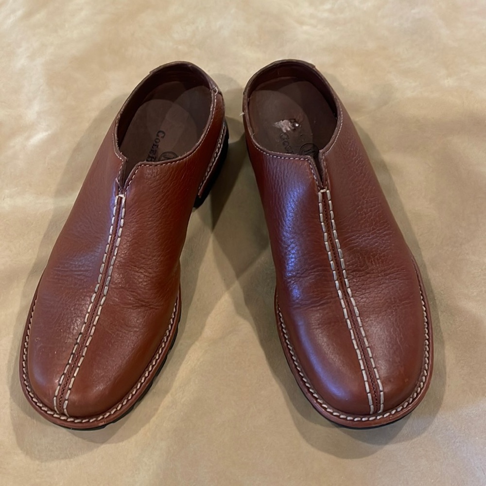 Reddish brown Cole Haan mules. 5B
